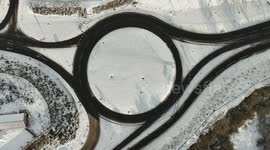 Drone View Of Roundabout With Traffic In Snow Today