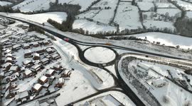 Drone captures roundabout in snow, but with little traffic due to todays strikes!