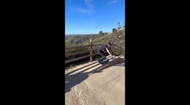 Skater collides head-on with biker in dramatic hill descent
