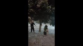 Man does the splits when he kicks tree to make snow fall