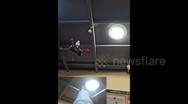 Innovative Chinese man uses drone to install light bulb