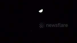 The Half Moon in the sky with Jupiter very close to it. Jupiter's moons could also be seen.