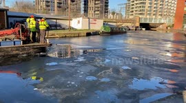 Workers break the ice on Regent’s Canal in London as sub-zero temperatures continue across the UK