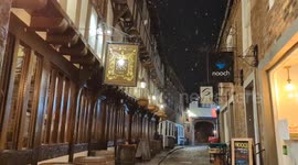 Light snow falling in a historic street, Shrewsbury.