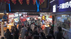 People at the shopping mall in Chongqing, China
