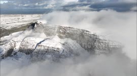 Beautiful Drone Footage Of Snow Covered Mountain With Fog During UK Cold Spell