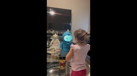 Girl is captivated by Moxie, the world's first AI robot for kids