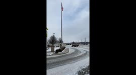 Stoic performer: Flag pole dances amidst the bone-chilling breeze
 