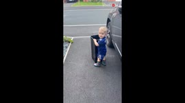 Adorable boy is daddy's most-trusted sidekick during recycling task