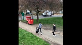 Youth workers overcome fears and open bin, unleashing foul-smelling odour