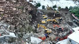 Drone footage showcases rescue teams battling against time to find survivors in China's landslide