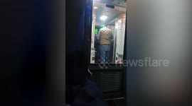 Group of passengers light bonfire abroad train to keep warm