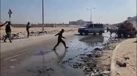 Transporting martyrs near the Khan Yunis shelter center