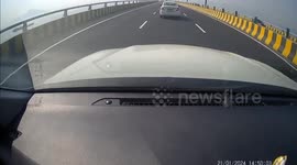 Five injured when red Suzuki hits crash barrier before flipping twice