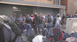 Refugees label eviction from city centre building a genocide as hundreds are left on the street and arrested in Cape Town