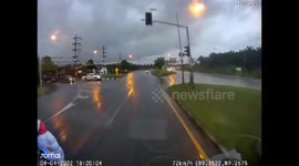 Car Spins Out on Rain Slick Street