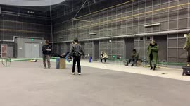 Chinese stuntman flies in harness while doing martial arts