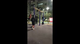 Agile boy leaps away from playground swing and lands with style