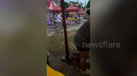 Kids enjoy play kitchen booth with families at temple fair