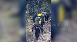 SDRF officials rush to aid of two after scooter loses control and falls into ditch in northern India