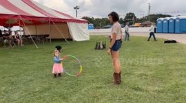 Border Collie Herds Ducks Through Hoop With a Little Helper