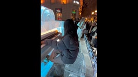 Confident Tourist Plays Ice Piano at Scenic Spot in Northern China