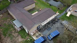 Drone shows scaffolding as workers prepare to tear down spa at Captain Tom's family's home