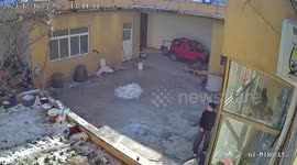 Man slides across frozen ground while trying and failing to catch bird