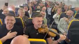 Fiddle playing folk musician entertains plane passengers