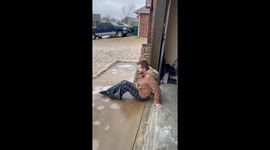 Icy adventure: Daniel slides down frozen driveway in Sand Springs, Oklahoma