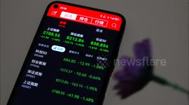 A stock investor's mobile phone in Yichang, China