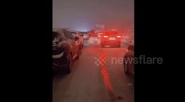 Blizzard strands Chinese New Year travellers on icy road for 8 hours