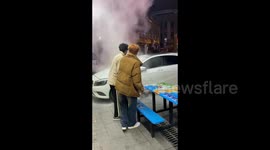 Two Men Extinguishing the Fire in Changsha, China