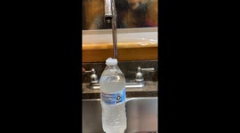 Laminar Flow Creates Water Bottle Waterfall