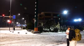 Vehicles Move Slowly on A Street With Snow in Yichang, China