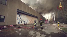 Firefighters Showcase Heroic Efforts Battling Factory Blaze in Milan, Italy