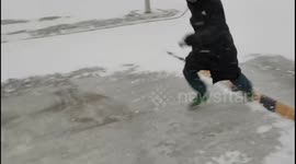 Two guys fall while sliding on ice in Cangzhou, China