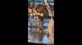 Marching band majorette keeps dancing through flood