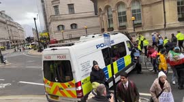 Cyclist argues with Israeli Protesters and is moved away by Police