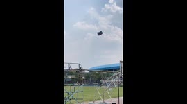 Strong gust of wind carries tent across school playing field