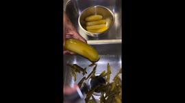 Blue Raspberry and Tequila Koolaid Pickles made by The owner of Pickled by PJ a Koolaid pickle company based out of Fort Worth Texas.