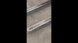 Worker demonstrates prowess by using forklift to flip coin