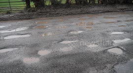 Residents mock council with sign saying road will “break your vehicles and your soul”