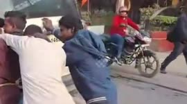 Four suspects push police car after it ran out of petrol while driving them to court