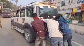 Four suspects push police car after it ran out of petrol while driving them to court in Northern India