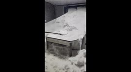 House covered in snow after residents forget to close bathroom windows