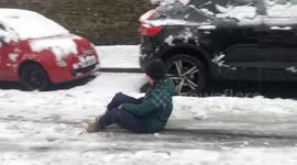 Sledging down roads, snowballs and stuck cars as Sheffield hit by snow in whiteout