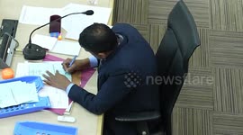 Election officer 'tampers with votes' before seeing video camera above his head