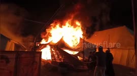 Fire tears through camp in northern India injuring 3