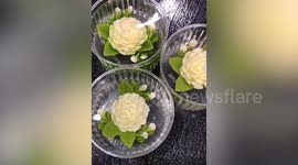 Watch how 3D flower designs are put inside jelly cake
